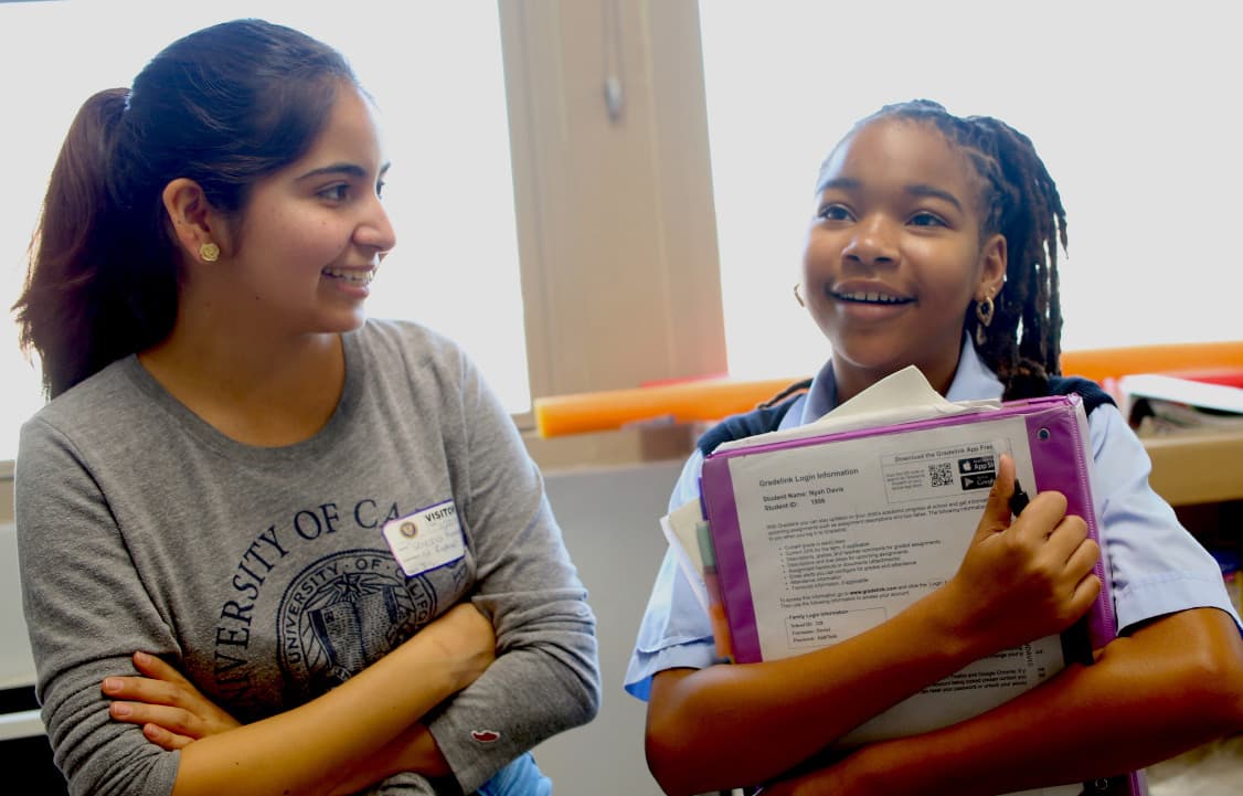 Mentor talking with student