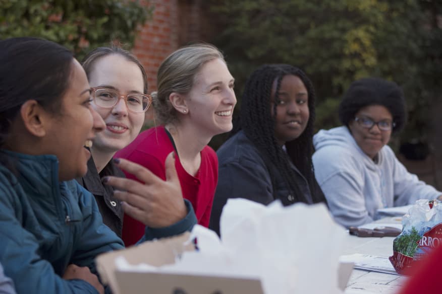 Women fellows laughing outdoors